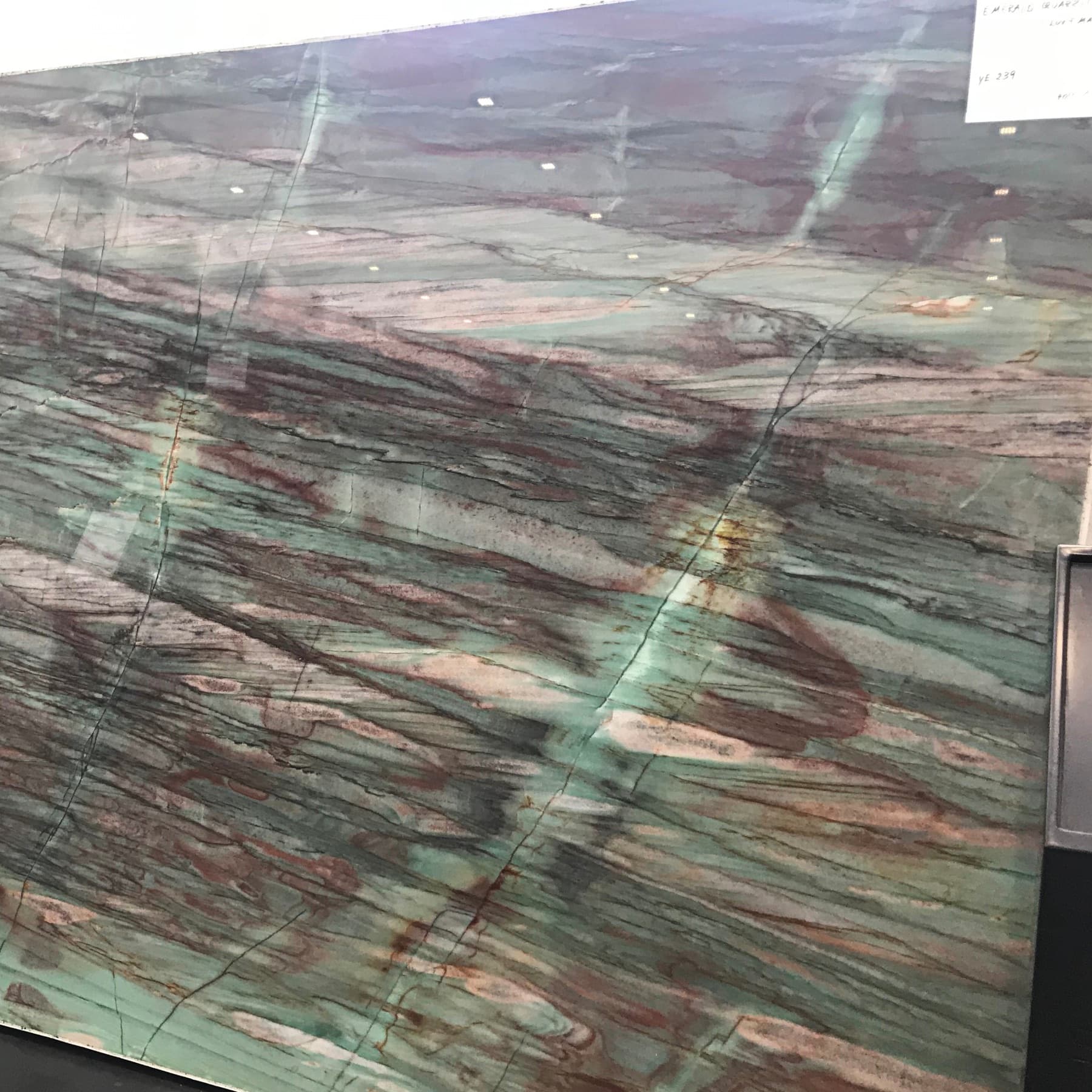 Green slab with long horizontal bands and darker movement